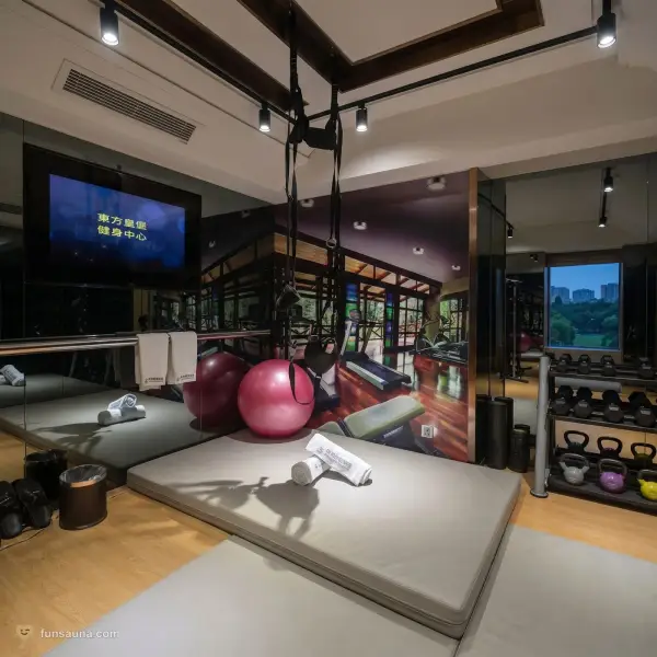 Gym-themed scenario room at East Castle Spa, Macau — weights and equipment dressed for role-play