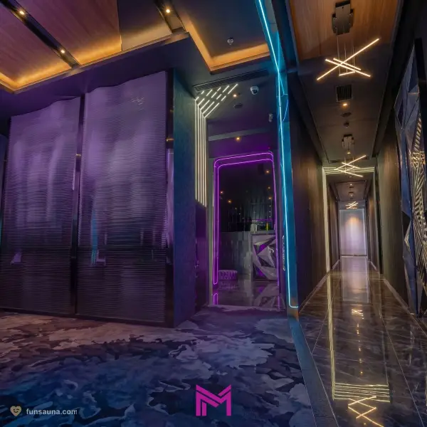 Neon mirror corridor at M CLUB Macau sauna reflecting cyberpunk lighting