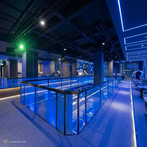 Manhao Spa Macau — deep blue neon lighting inside the glass-railed showcase hall in Taipa